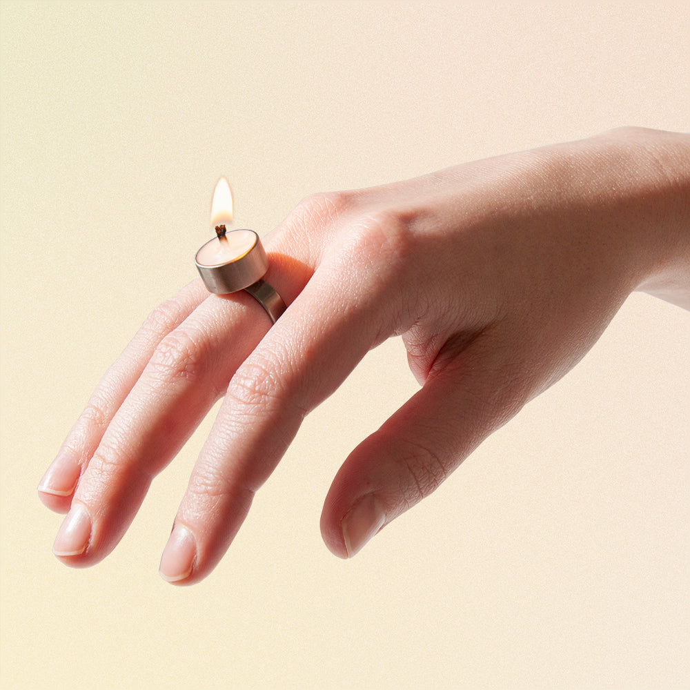 candle ring burning flame on hand jewelery