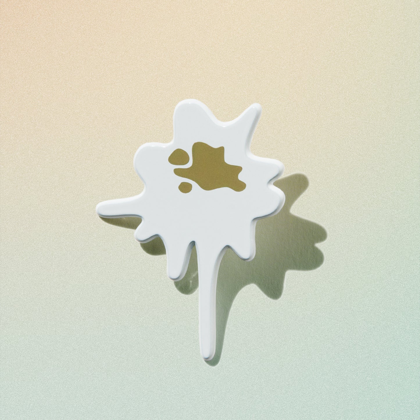 close-up of bird poop enamel pin