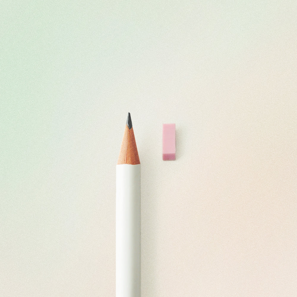 tiny pink school eraser next to a pencil