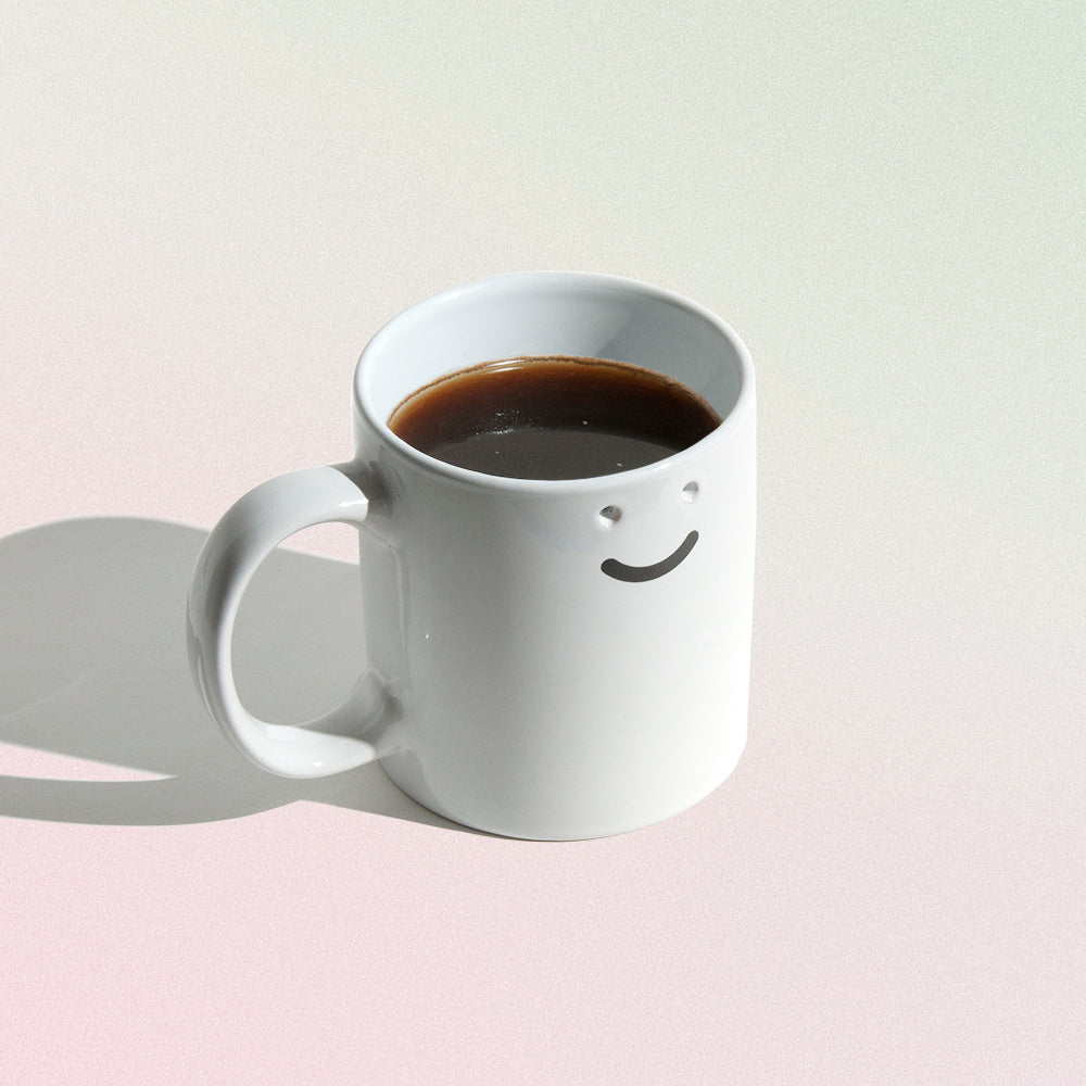 happy face mug with 2 holes for eyes