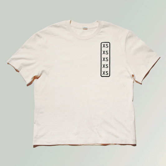 A t-shirt displaying the long size label sticker on the chest area, but it's actually permanently embroidered