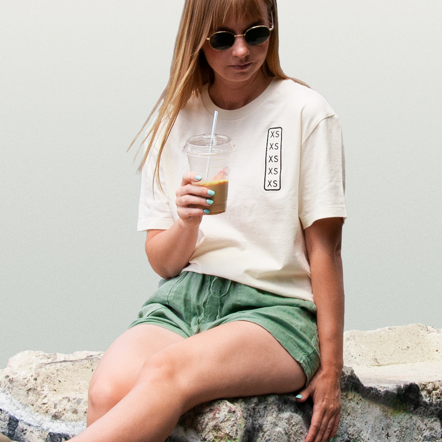 Shirt with permanent embroidery printed size label on front